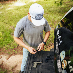 mucker bucket - chasin' tail bucket snapback hat on model