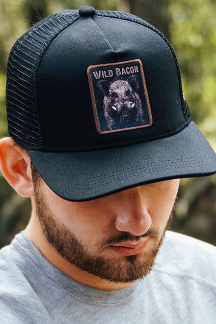 mucker bucket - wild bacon og hog trucker hat on model
