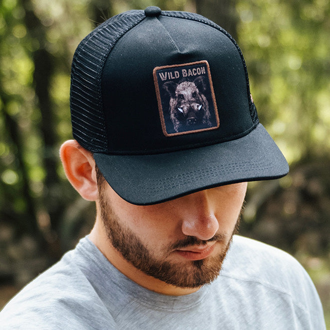 mucker bucket - wild bacon og hog trucker hat on model