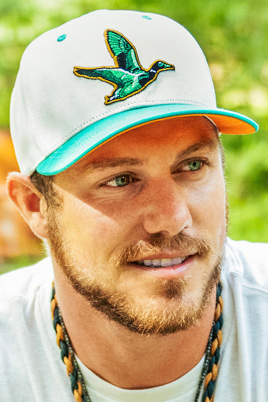 mucker bucket - duck og embroidered patch hat on model