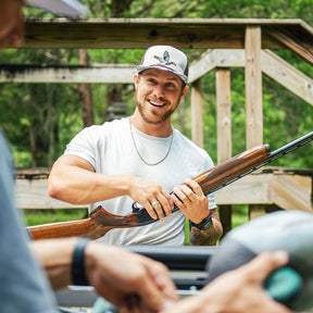 mucker bucket - camo duck bucket hat on men's model