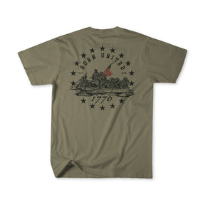 The Born United Patriot Box by Born United Private Label features an olive green tee with soldiers raising a flag, stars, and “BORN UNITED” above “1776.” Part of the Patriot Box Limited Edition Tees collection.