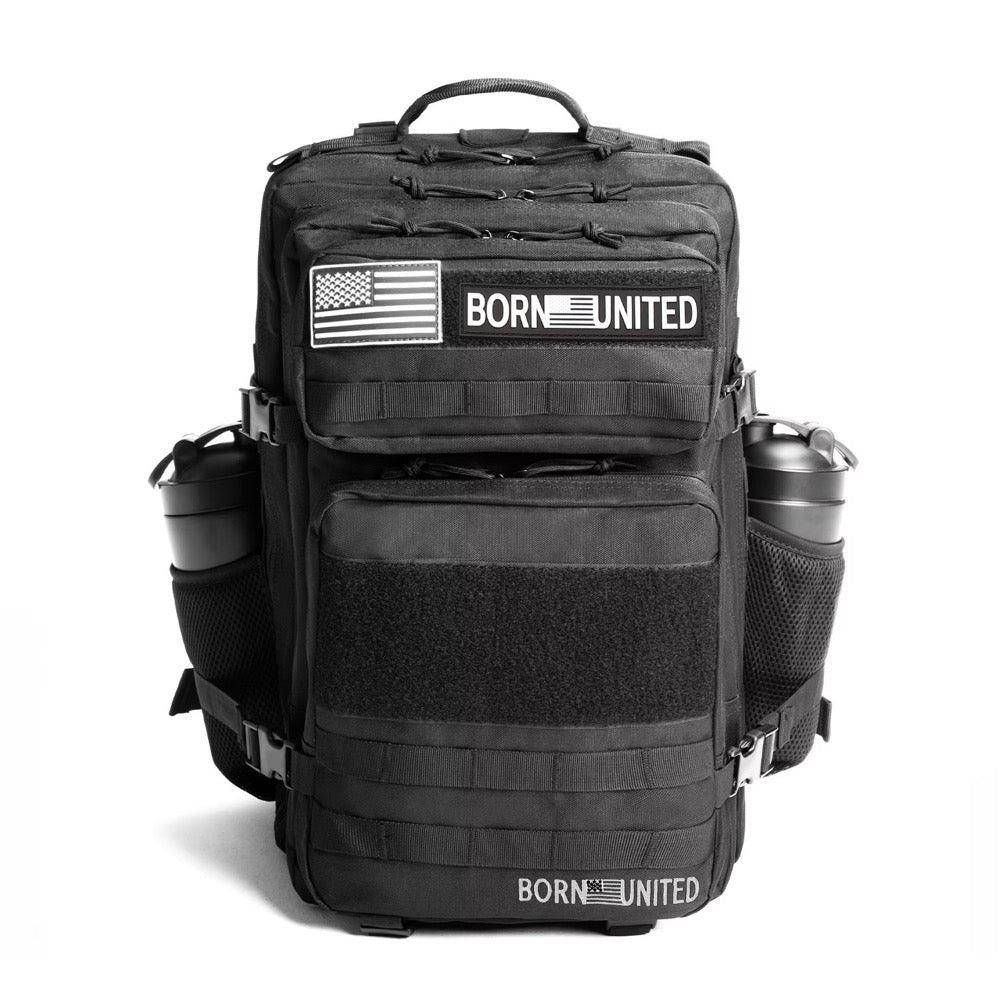 The Midnight Black Premium Tac-Pac - 45L by Born United Private Label features BORN UNITED and American flag patches, multiple compartments, two water bottles in side mesh pockets, and a sturdy top handle.