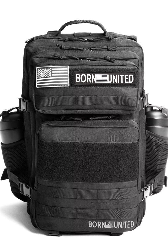 The Midnight Black Premium Tac-Pac - 45L by Born United Private Label features BORN UNITED and American flag patches, multiple compartments, two water bottles in side mesh pockets, and a sturdy top handle.