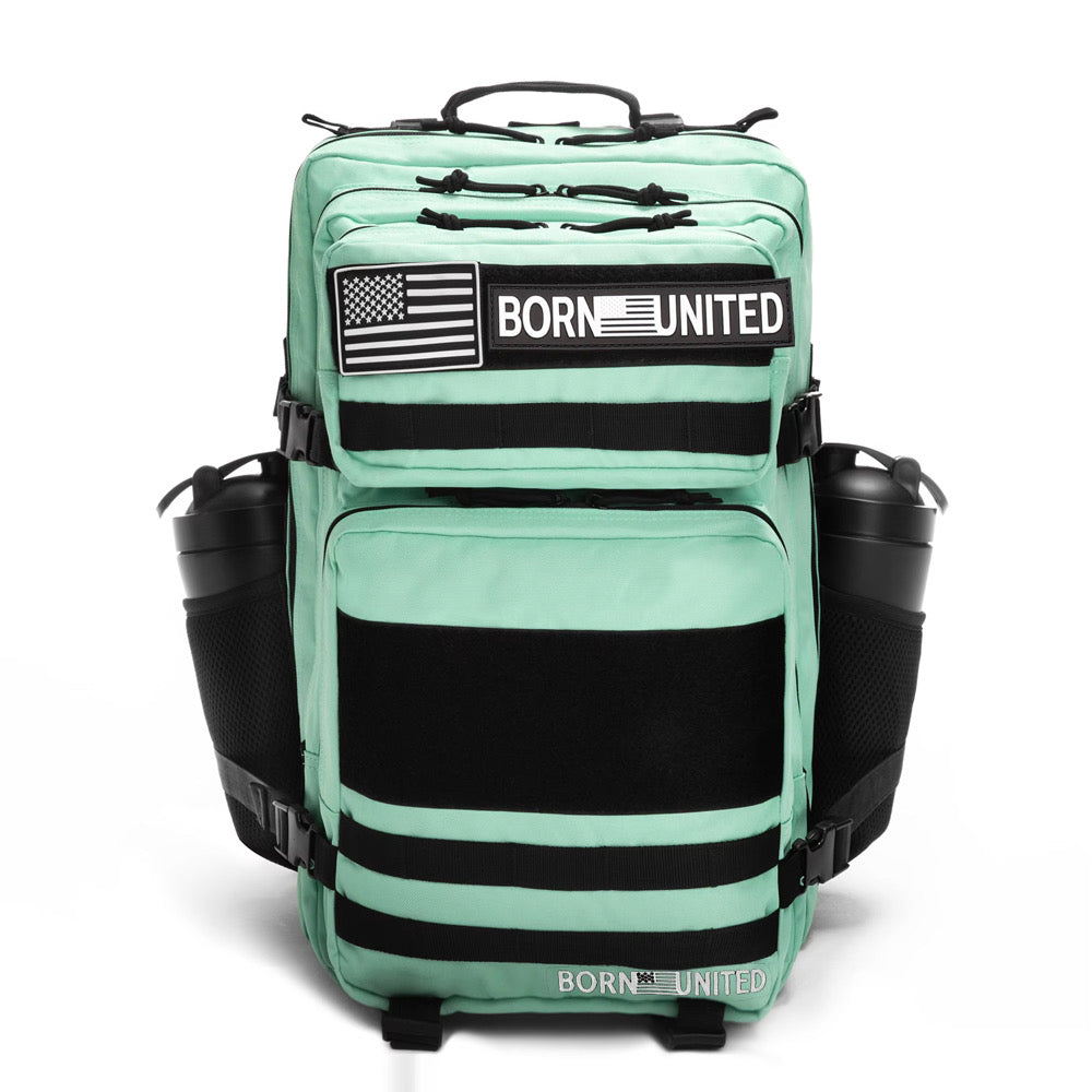 The Born United Private Label Mint Condition Premium Tac-Pac - 45L features black zippers, accents, American flag patches, BORN UNITED text on the front, and side pockets each holding a black water bottle.