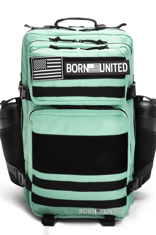 The Born United Private Label Mint Condition Premium Tac-Pac - 45L features black zippers, accents, American flag patches, BORN UNITED text on the front, and side pockets each holding a black water bottle.