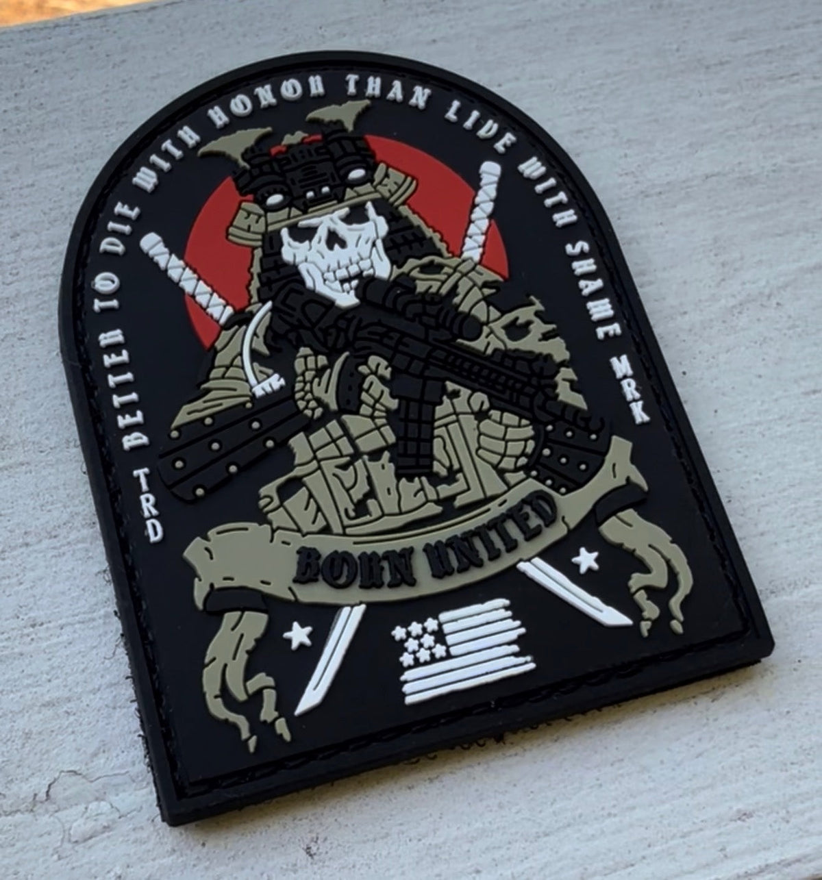 The With Honor PVC Patch by Born United Private Label shows a skeleton in tactical gear with a rifle, crossed katanas, red circle, American flag, and the phrase "Better to die with honor than live with shame. Born United." Velcro backing included.