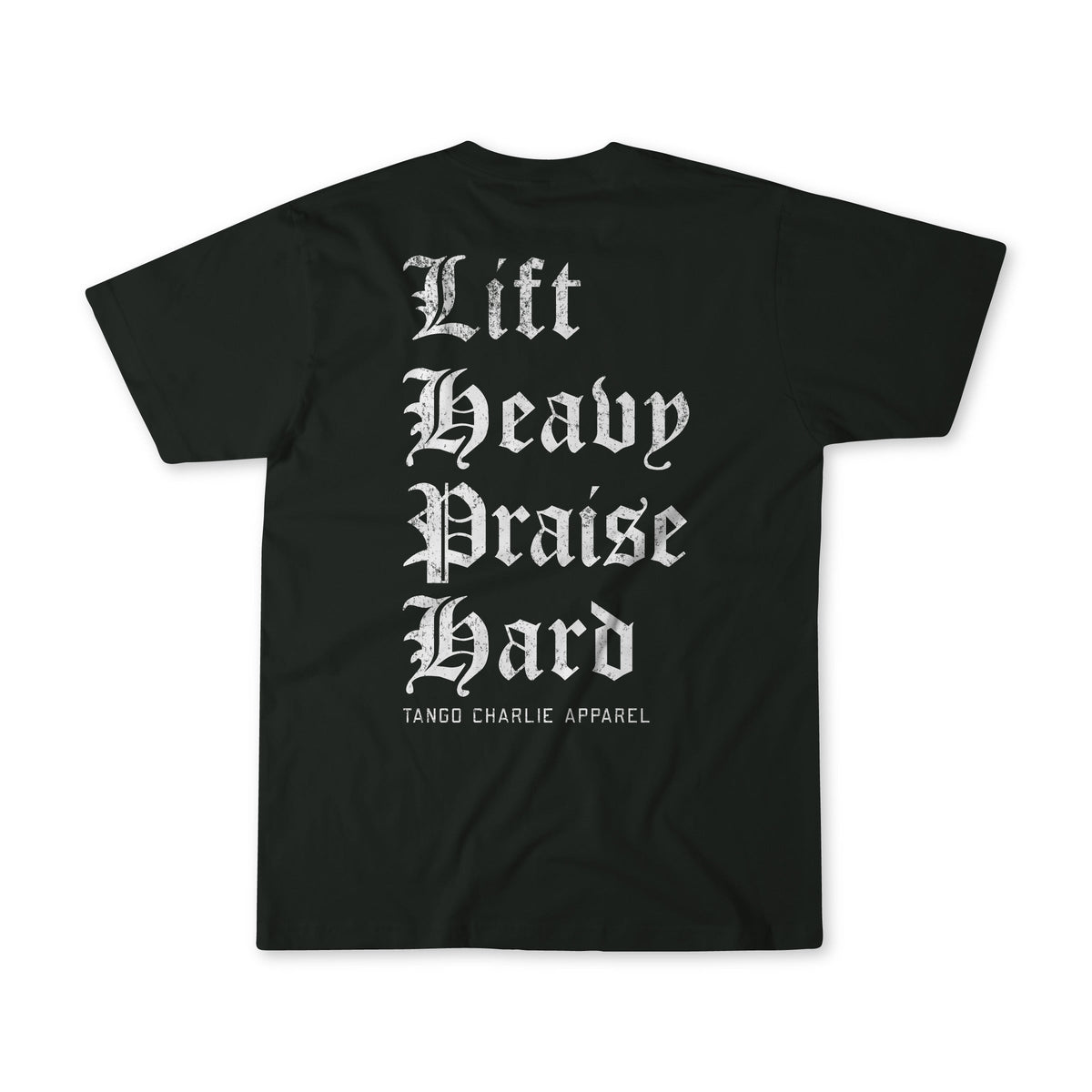 Black tee featuring bold white Gothic text that reads “Lift Heavy. Praise Hard.” with subtle Tango Charlie Apparel branding beneath—a striking expression of resilience.