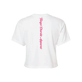 The Feral - Women's White Crop by Tango Charlie Apparel is shown from the back with “Tango Charlie Apparel” printed vertically in pink cursive down the center.
