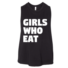 The Girls Who Eat Crop Tank by Tango Charlie Apparel is a comfy black sleeveless top with bold white “GIRLS WHO EAT” text—perfect inspirational gym wear.