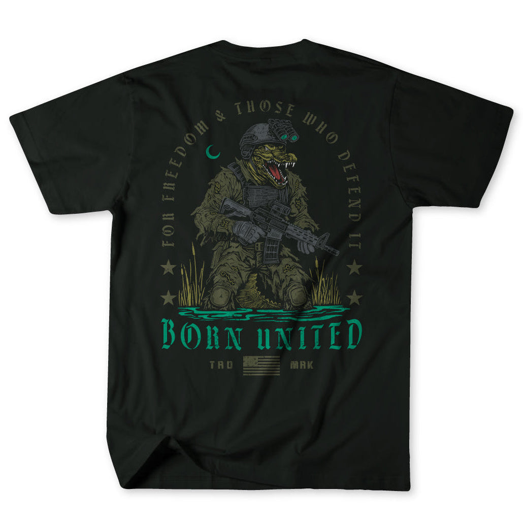 The Born United Private Label Black Box - Tactigator t-shirt features an alligator in military gear with a rifle, surrounded by "For Freedom & Those Who Defend It" and "Born United," plus stars and a crescent moon above.