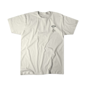 Jesus Saves - White Tee by 13th: A beige T-shirt featuring a small black intricate design and 13TH text on the left chest, displayed against a white background.