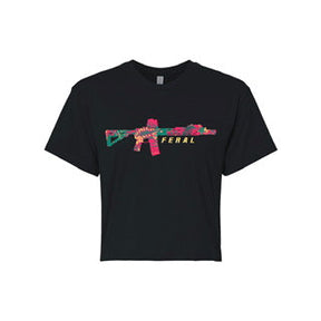 The Feral Crop Tee - Black by Tango Charlie Apparel is a comfyAF cotton-poly blend featuring a colorful abstract rifle illustration with “FERAL” in yellow underneath—perfect for all-day wear.