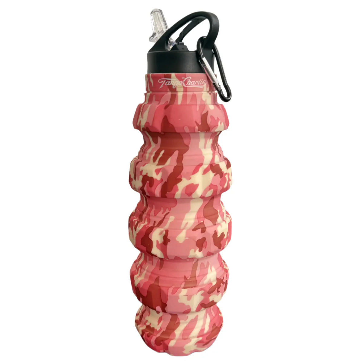 The Pink Camo Humble + Hydrated 20oz Water Bottle by Tango Charlie Apparel is a BPA-free, food-grade silicone bottle with a red, pink, and beige camo pattern, black flip-top lid and straw, plus a black carabiner for on-the-go hydration.