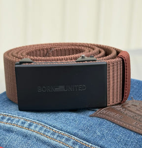The BU Logo Belt - Brown by Born United Private Label, featuring a black rectangular buckle with the BORN UNITED logo, is shown on blue jeans with a visible Levis leather patch.