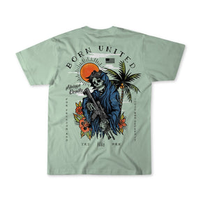 The Always Deadly- Mint tee by Born United Private Label features a skeleton in a blue cloak with a rifle under a red sun, black birds, and palm trees. BORN UNITED and Always Deadly text with small symbols complete the bold design.