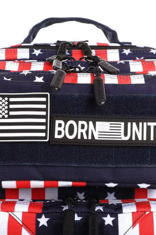 Introducing the Ultimate Patriot Special Edition Tac-Pac - 25L by Born United Private Label, featuring an Americana flag pattern with BORN UNITED text. This unique backpack offers multiple zippers, compartments, and sleek black straps for style and functionality.