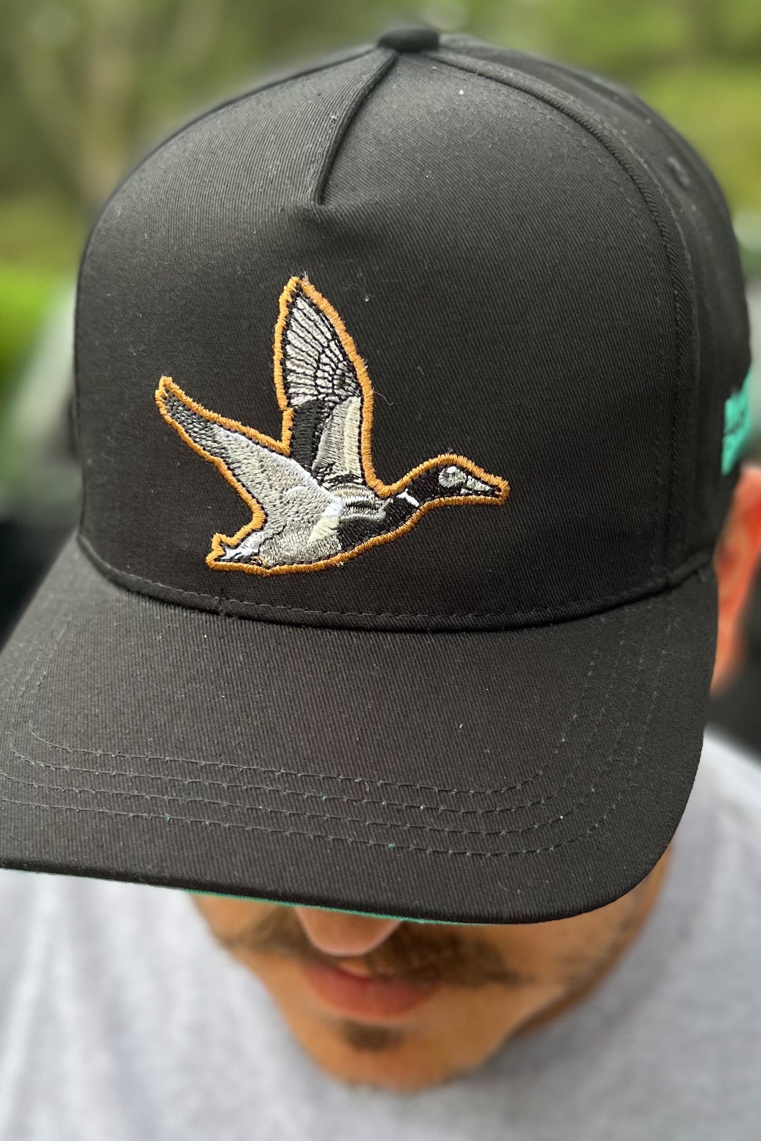 mucker bucket - black duck bucket hat on model