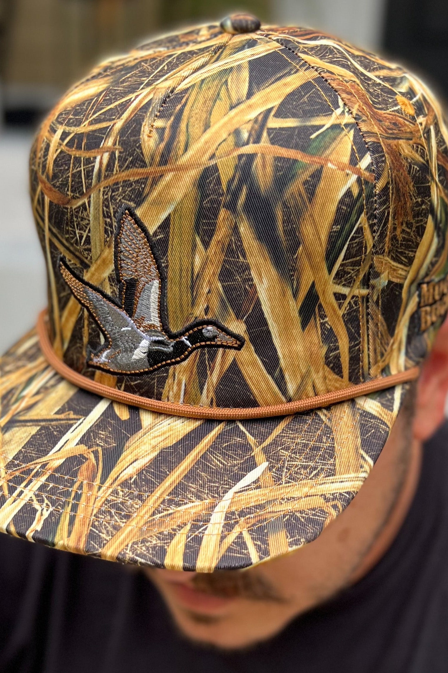 mucker bucket - straw grass camo duck hat on model