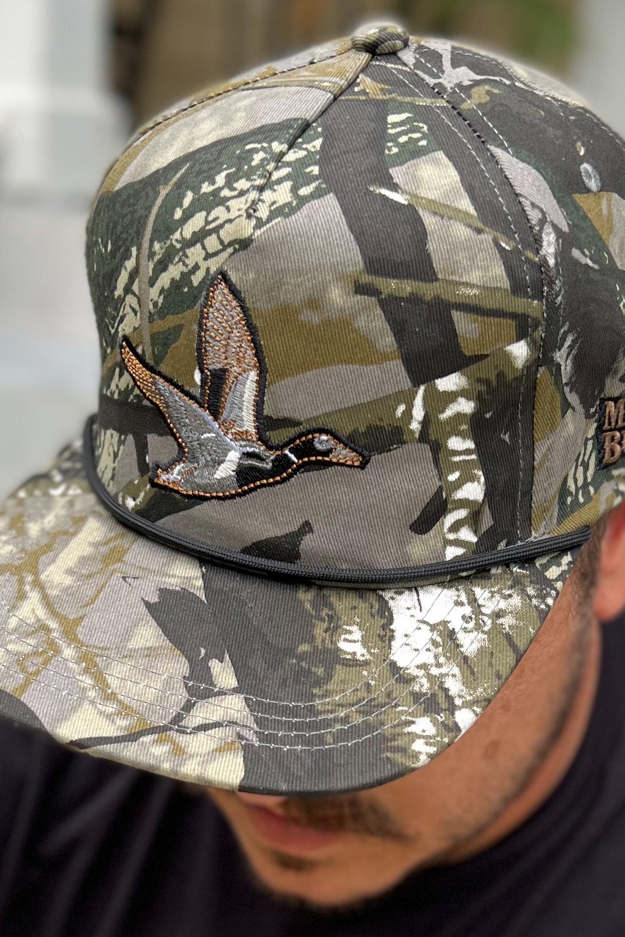 mucker bucket - treestand oak camouflage duck snapback hat on model