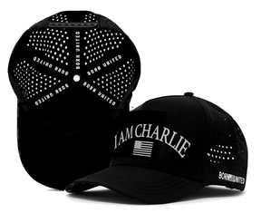 Two black I Am Charlie Black Snapback hats by Born United Private Label, featuring “I AM CHARLIE” and an American flag on the front, and “BORN UNITED” in white inside and on the side. Breathable, handmade 5-panel flat bill design for style and comfort.
