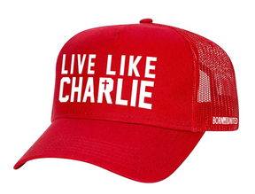 The Live Like Charlie Trucker by Born United Private Label is a red mesh flat-bill hat with white "LIVE LIKE CHARLIE" text on the front, "BORN UNITED" on the side, and a breathable snapback for all-day comfort.