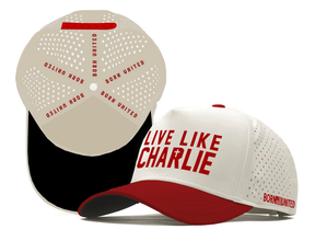 The Live Like Charlie Ivory Snapback by Born United Private Label features a white and red design with perforated sides, bold red "LIVE LIKE CHARLIE" on the front, "BORN UNITED" on the brim and inside, and a black underside.