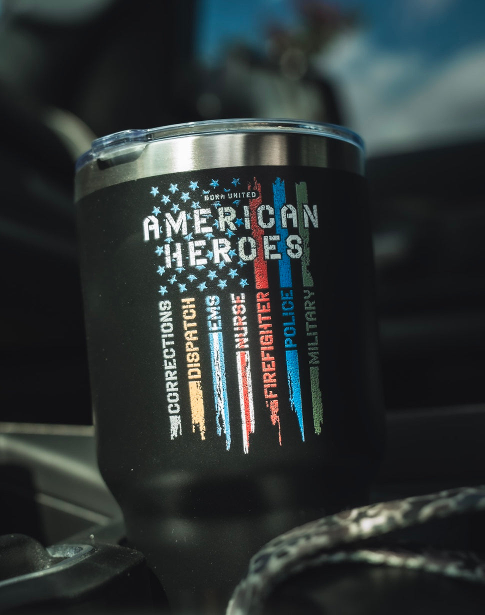 The Born United Private Label American Heroes Tumbler - 30oz is black with a distressed American flag design, colored stripes, and words for Corrections, Dispatch, EMS, Firefighter, Police, and Military.