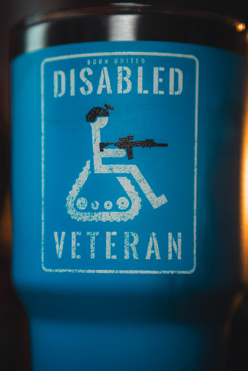 The Disabled Veteran Tumbler - 30oz by Born United Private Label features a blue design with a white wheelchair symbol holding a rifle and “Disabled Veteran” plus “Born United” at the top—ideal as a stainless steel disabled veteran tumbler.