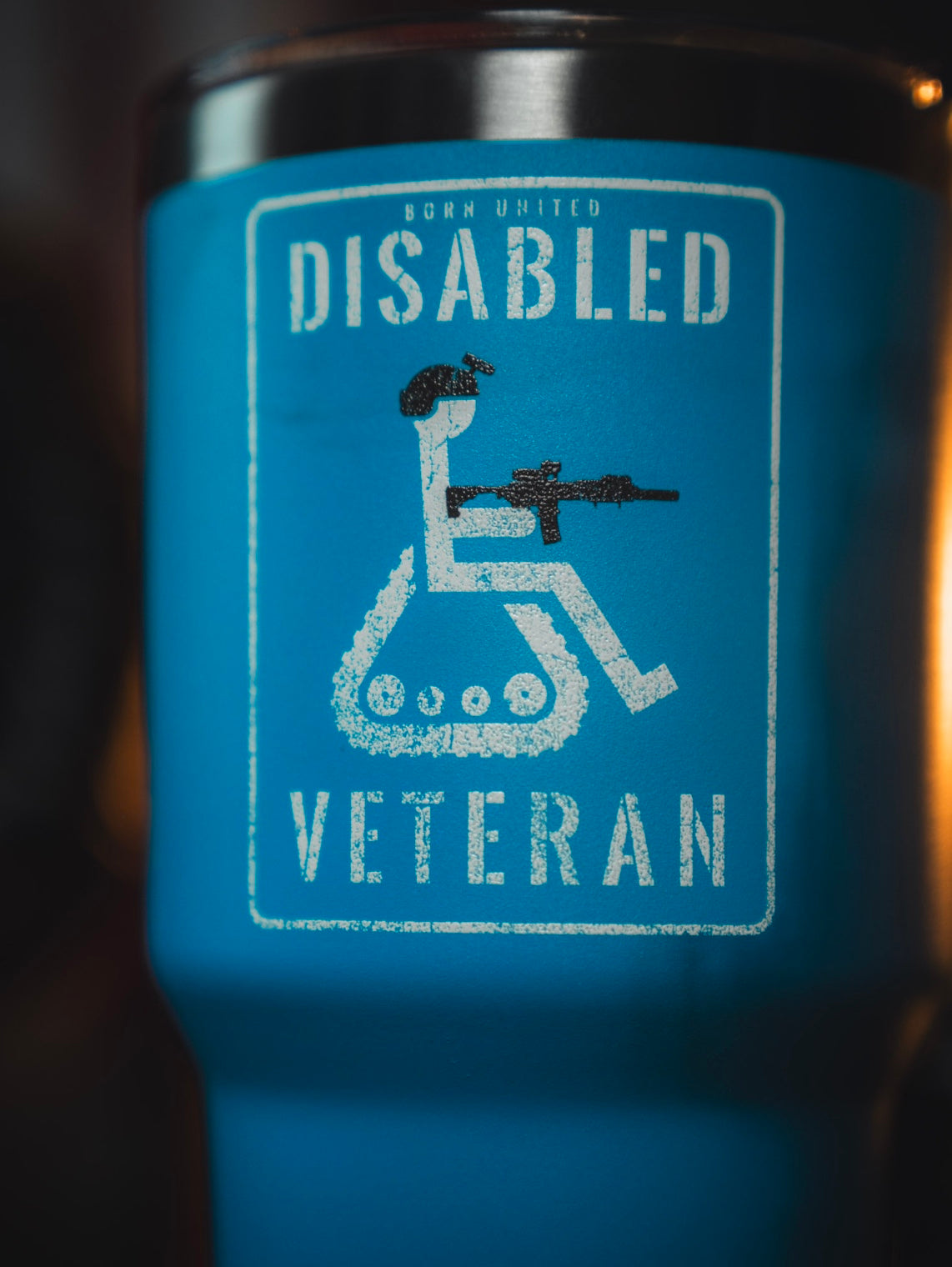 The Disabled Veteran Tumbler - 30oz by Born United Private Label features a blue design with a white wheelchair symbol holding a rifle and “Disabled Veteran” plus “Born United” at the top—ideal as a stainless steel disabled veteran tumbler.