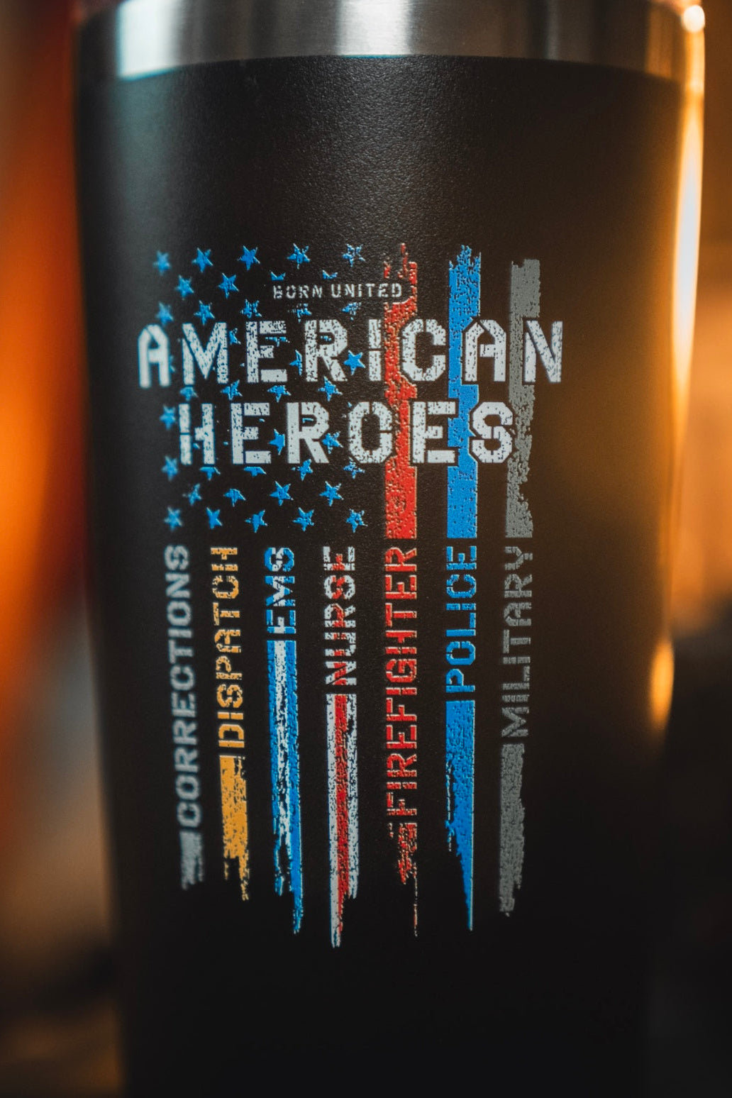 Show your pride with the Born United Private Label American Heroes Tumbler - 20oz, featuring a distressed flag and colored stripes for Corrections, Dispatch, Nurse, Firefighter, Police, and Military. Celebrate real heroes in style!.