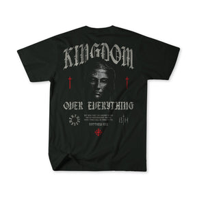 The 13th Kingdom Over Everything Premium Tee features a grayscale Jesus face, "KINGDOM OVER EVERYTHING" text, red crosses, Matthew 6:33 in gothic font on the back, and decorative accents.