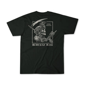 The “Memento Mori” black t-shirt by Born United Private Label features a skeleton Roman soldier with a rifle and scythe, plus “Born United” above and “Memento Mori” below—combining bold style with classic philosophical meaning.
