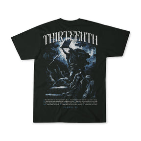 The Ten Commandments Premium Tee by 13th is a black shirt with a striking image of Moses holding the tablets, crowds below, "THIRTEENTH" at the top, and Exodus 20 with Christian commandments at the bottom.