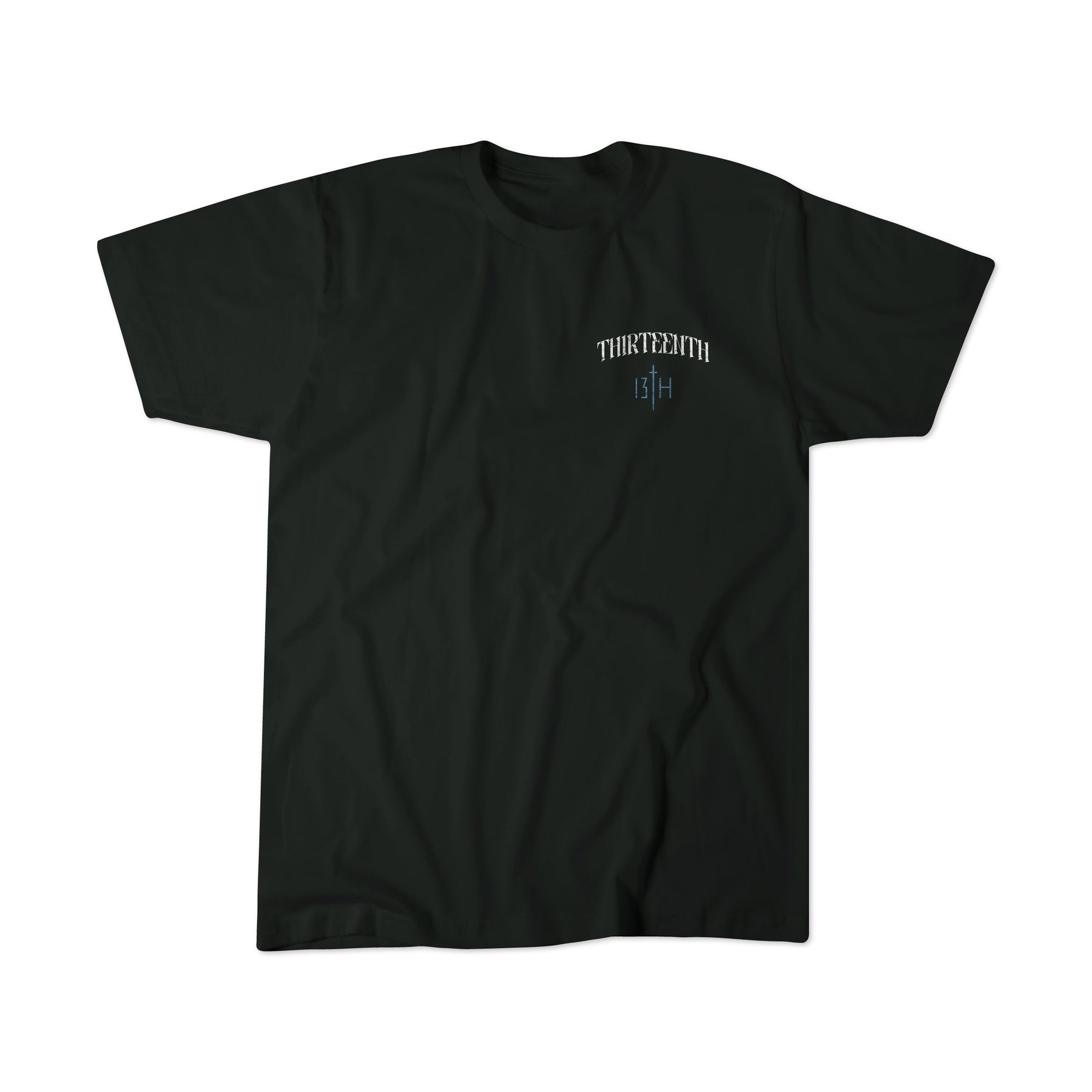 The Ten Commandments Premium Tee by 13th is a black short-sleeve shirt featuring small white "THIRTEEN" and "13 H" text in a stylized font on the upper left chest, displayed on a plain white background.