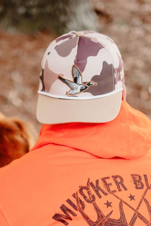 mucker bucket - leaf camouflage duck embroidered hat on model