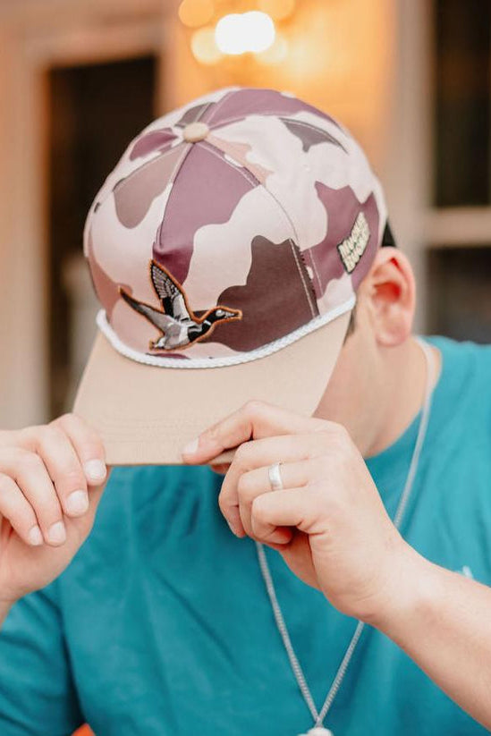 mucker bucket - leaf camouflage duck bucket hat on model