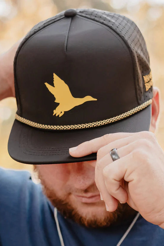 mucker bucket - duck king water resistant hat on model