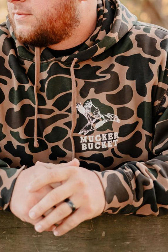 mucker bucket - wood duck camo hoodie front on model