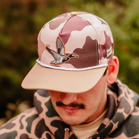 mucker bucket - leaf camo duck bucket hat on model