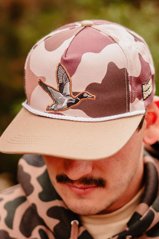 mucker bucket - leaf camo duck bucket hat on model