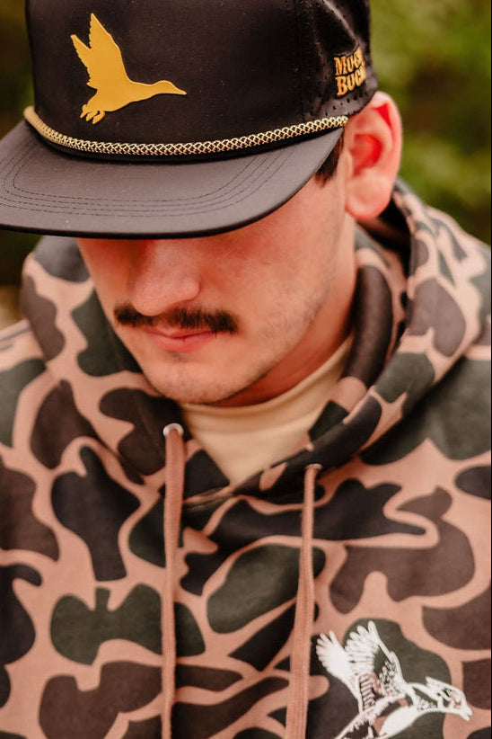 mucker bucket - wood duck camouflage hooded sweatshirt on model