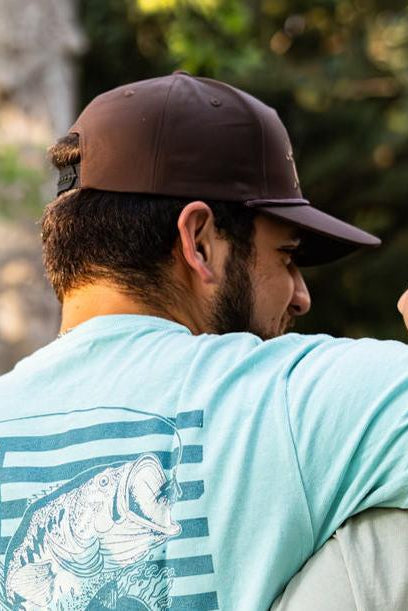 mucker bucket - wild bacon vintage snapback hat on model