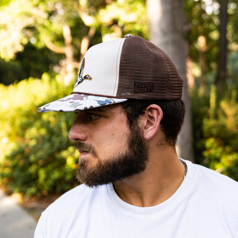 mucker bucket - camo duck bucket hat on model side