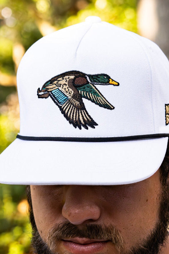 mucker bucket - mallard trucker hat on model