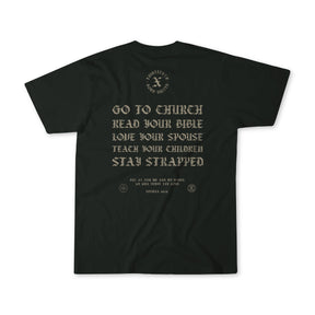 The Kingdom Protector Premium Tee by Born United Private Label is a black shirt with gold "Go to church, read your Bible, love your spouse, teach your children, stay strapped" text on the back and a small Joshua 24:15 verse.