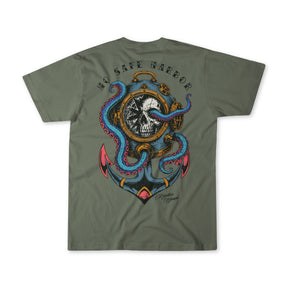 The Relentless Betrayal No Safe Harbor Premium T-Shirt in olive is crafted from fine jersey cotton and showcases a bold graphic of a skull within a ship’s wheel, entwined with octopus tentacles and an anchor, topped by the striking phrase “NO SAFE HARBOR.”.