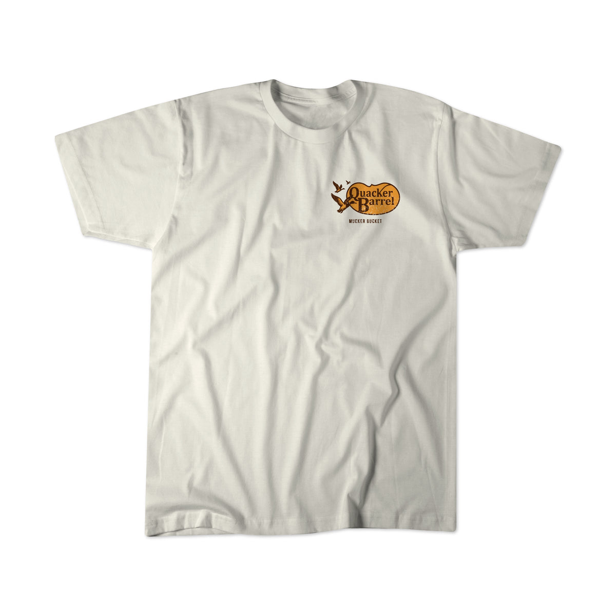 The Quacker Barrel Premium Tee by Mucker Bucket is a plain white, relaxed fit shirt with a small brown and yellow “Old Country Store” logo on the upper left chest.