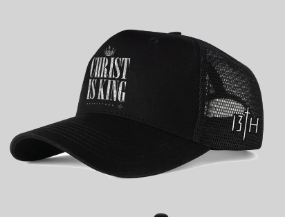 The 13th Christ is King Trucker Snapback is a black mesh hat with “Christ is King” in bold white letters on the front and a 13TH plus cross design on the side.