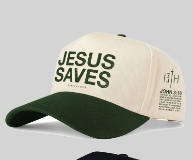 The 13th Jesus Saves Ivory Snapback is a premium cream and green cap with "JESUS SAVES" in bold green, plus 13TH and John 3:16 printed on the side.